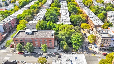 a view of a house with a lot of flower plants