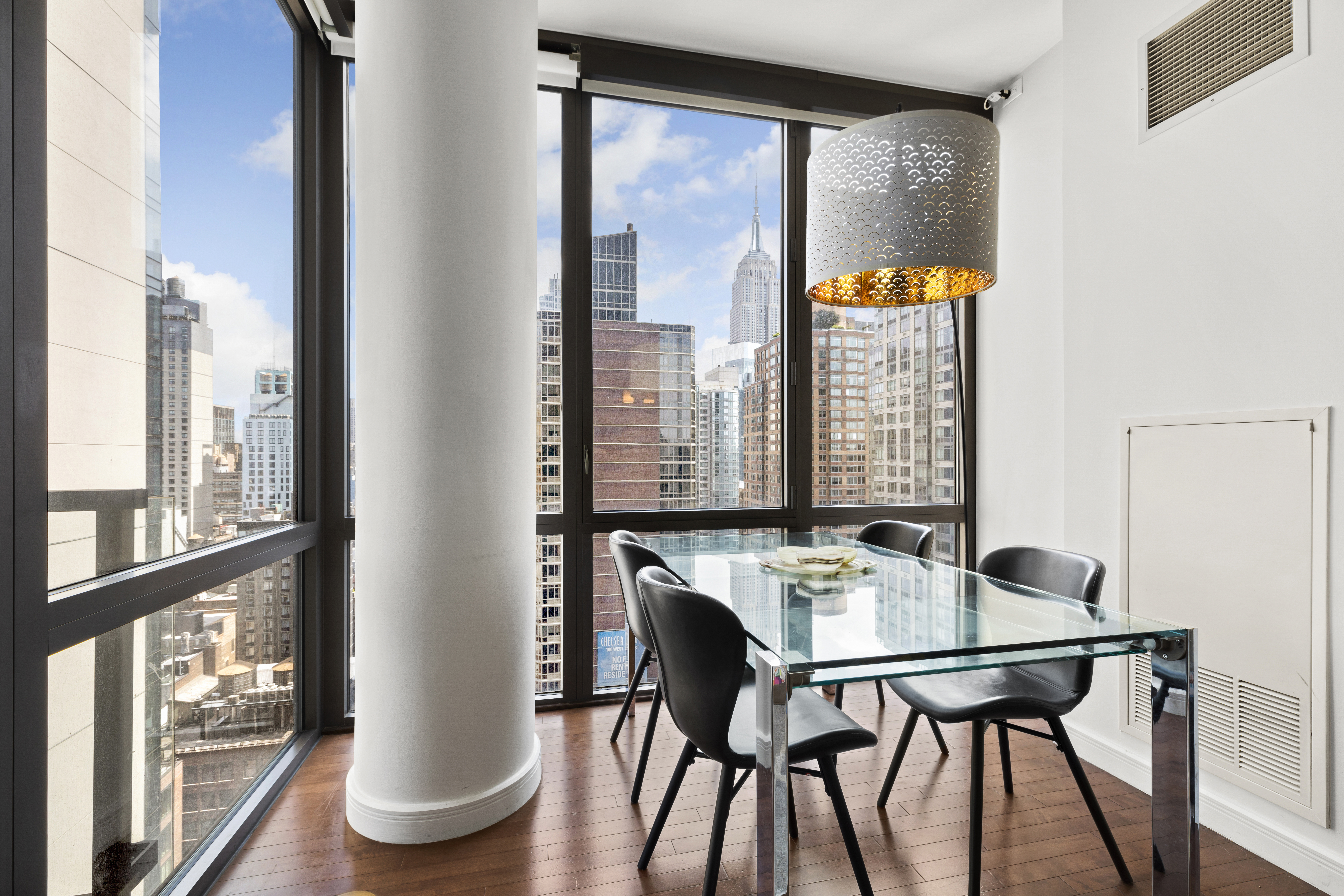 101 West 24th Street, Unit 26A Manhattan, NY 10011 - Photo 4 of 21 a view of a dining room with furniture and a window