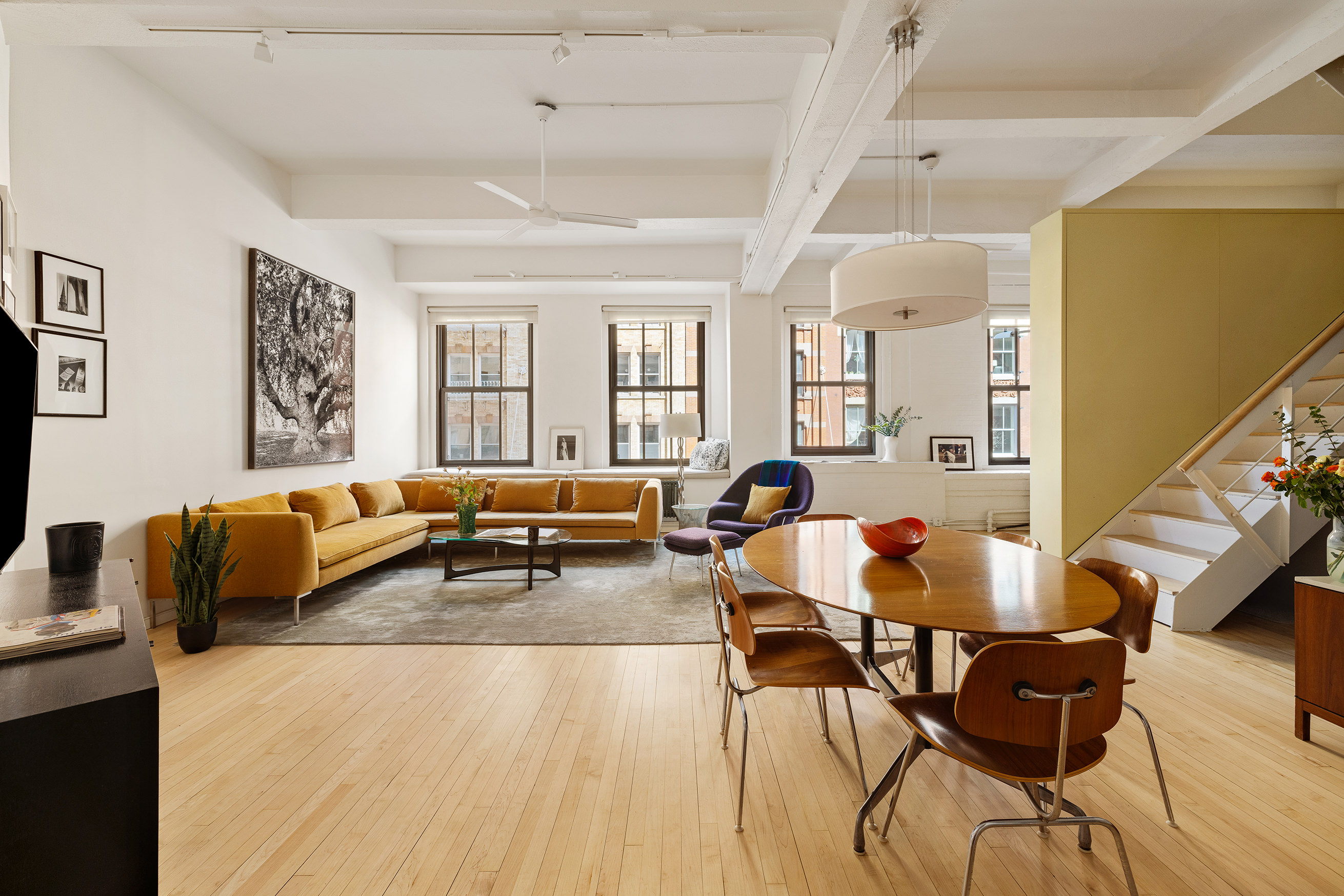 20 Jay Street, Unit 2/3C Manhattan, NY 10013 - Photo 1 of 16 a living room with furniture and wooden floor