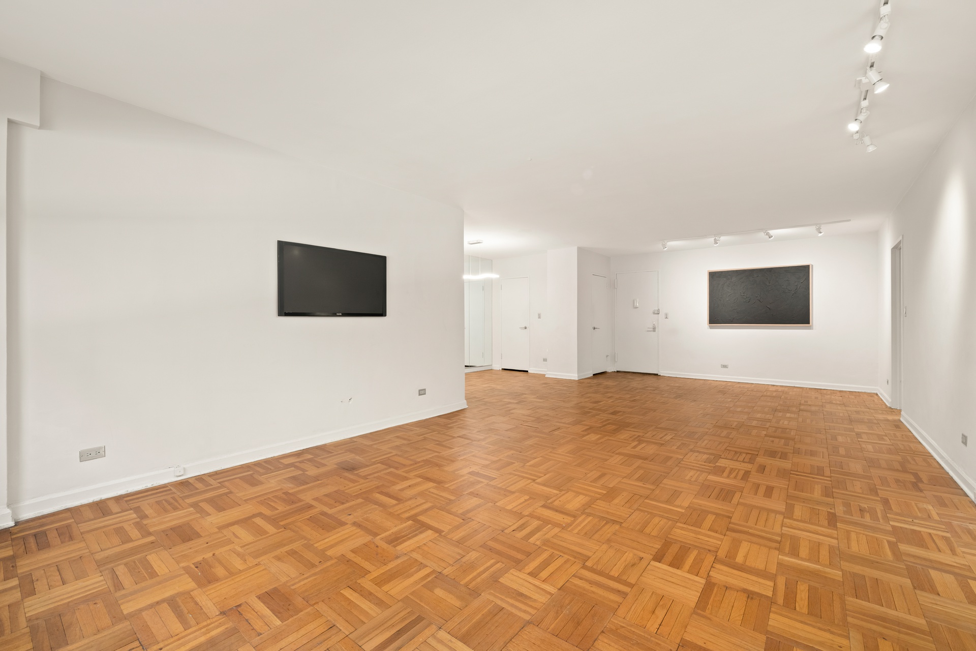 70 East 10th Street, Unit 2P Manhattan, NY 10003 - Photo 3 of 17 a view of a livingroom with a flat screen tv