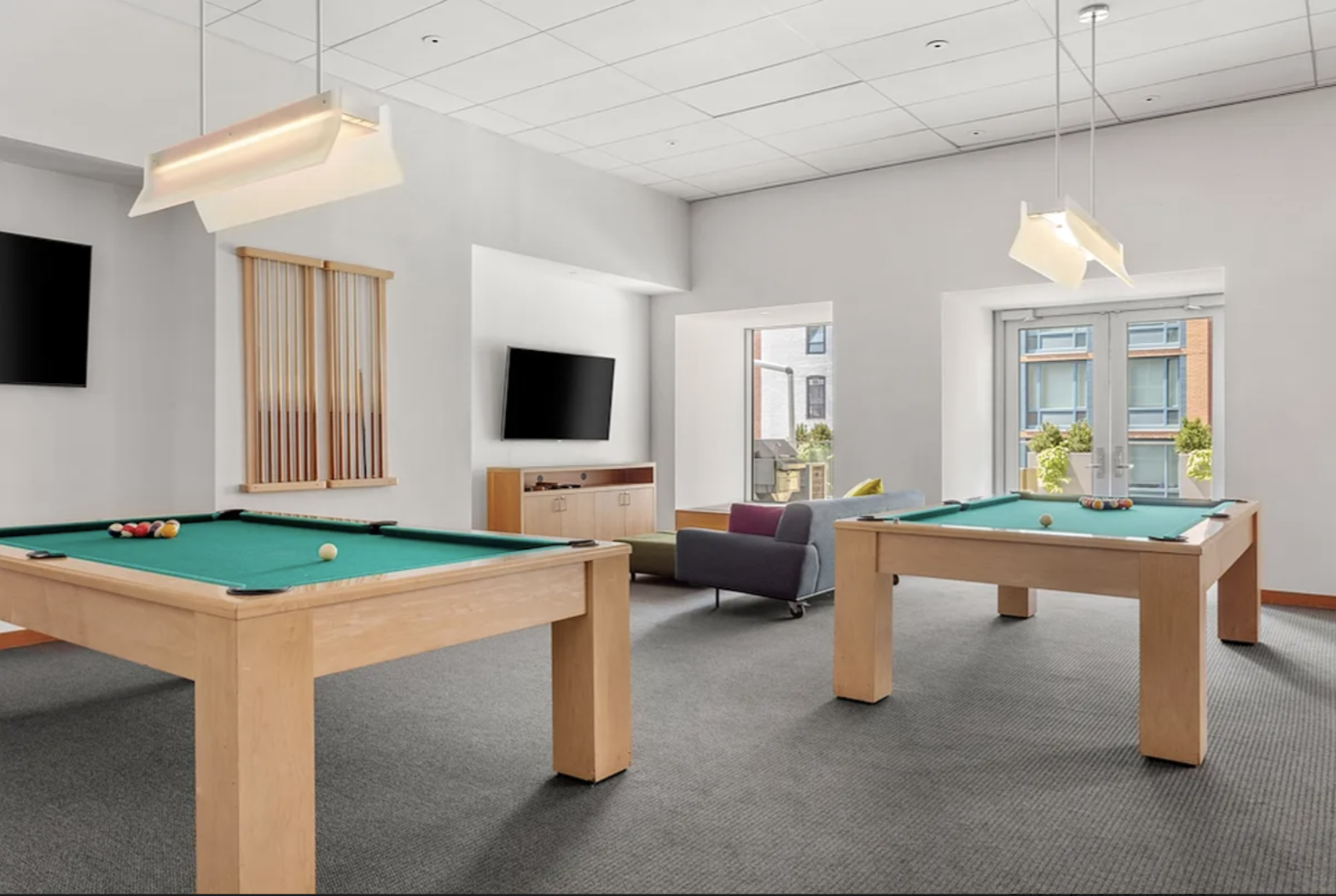 Spruce Street, Unit 12A Manhattan, NY 10038 - Photo 11 of 18 a room with furniture a flat screen tv and a table