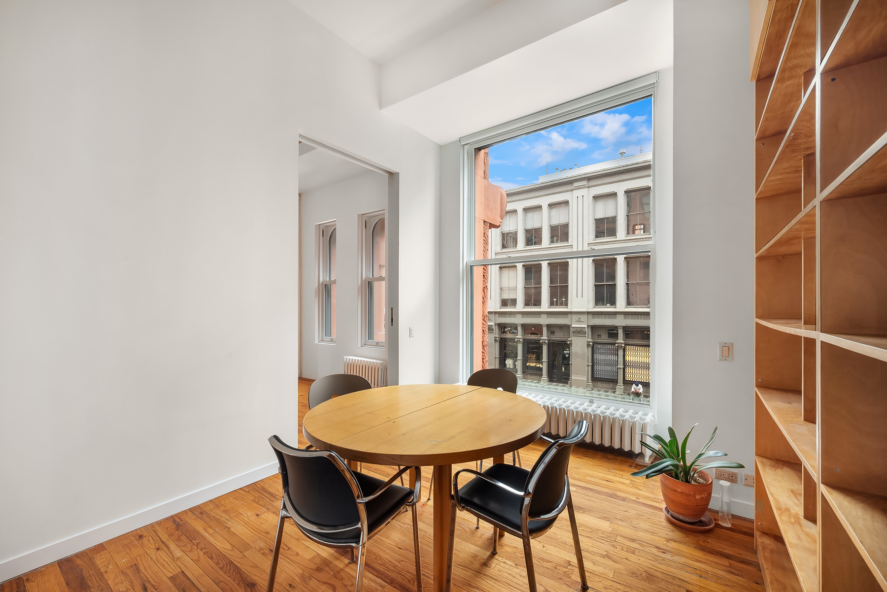 59 Wooster Street Manhattan, NY 10012 - Photo 3 of 10 a outdoor dining space with furniture and wooden floor