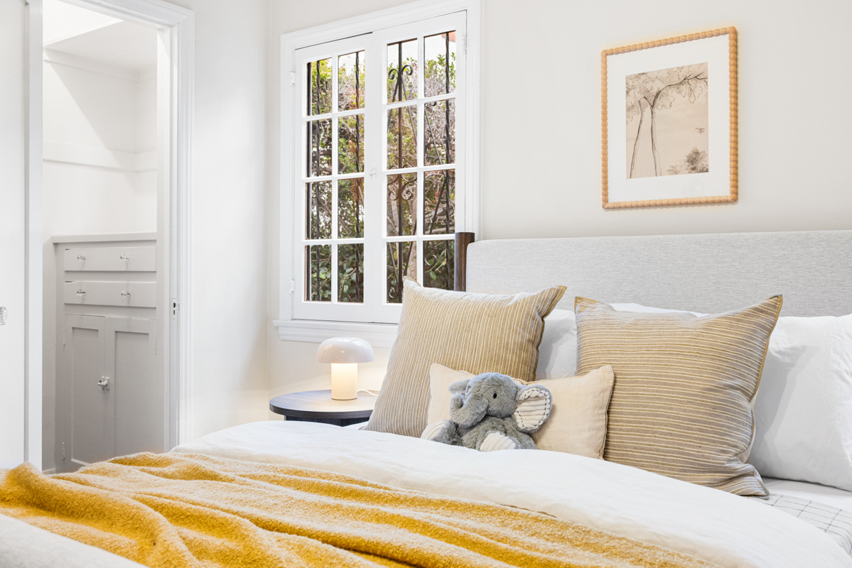 926 Burnside Avenue Los Angeles, CA 90036 - Photo 35 of 71 a bedroom with a bed and a window