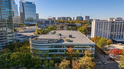 a balcony with furniture and a potted plant