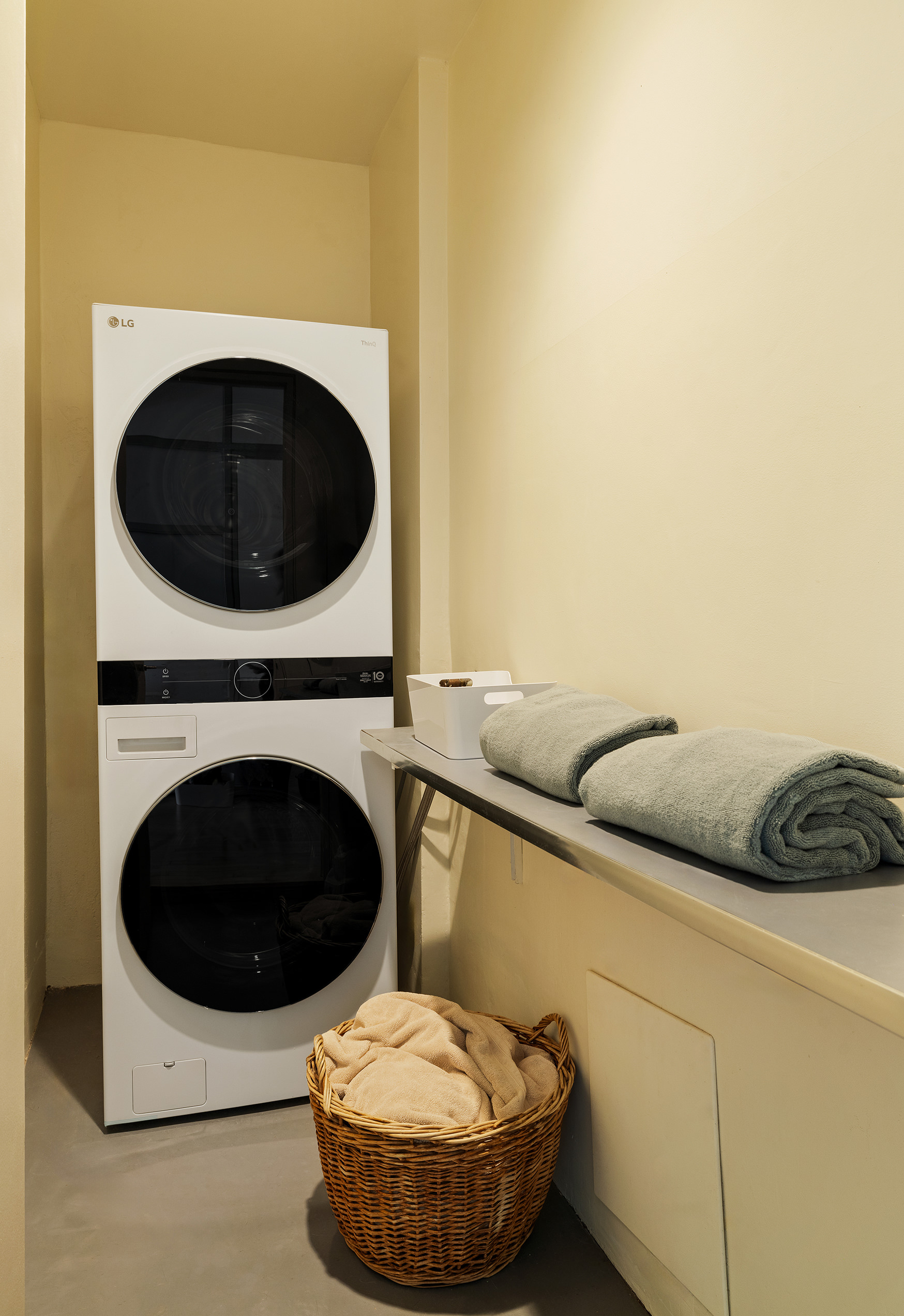 20 Jay Street, Unit 2/3C Manhattan, NY 10013 - Photo 13 of 16 a living room with furniture and a washer dryer