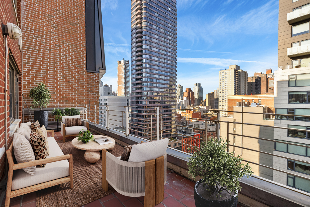 510 East 86th Street, Unit 17C Manhattan, NY 10028 - Photo 14 of 31 a view of a balcony with chairs and a potted plant