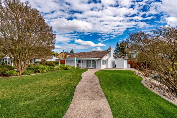 front view of a house with a yard