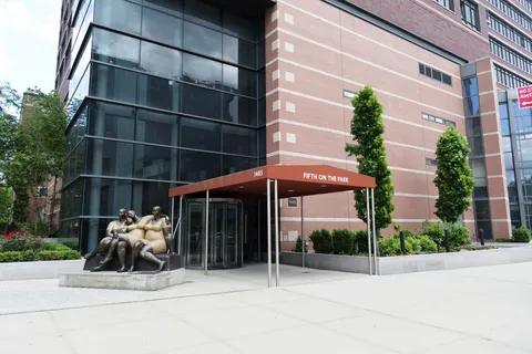 a view of a chair and tables in patio of a building