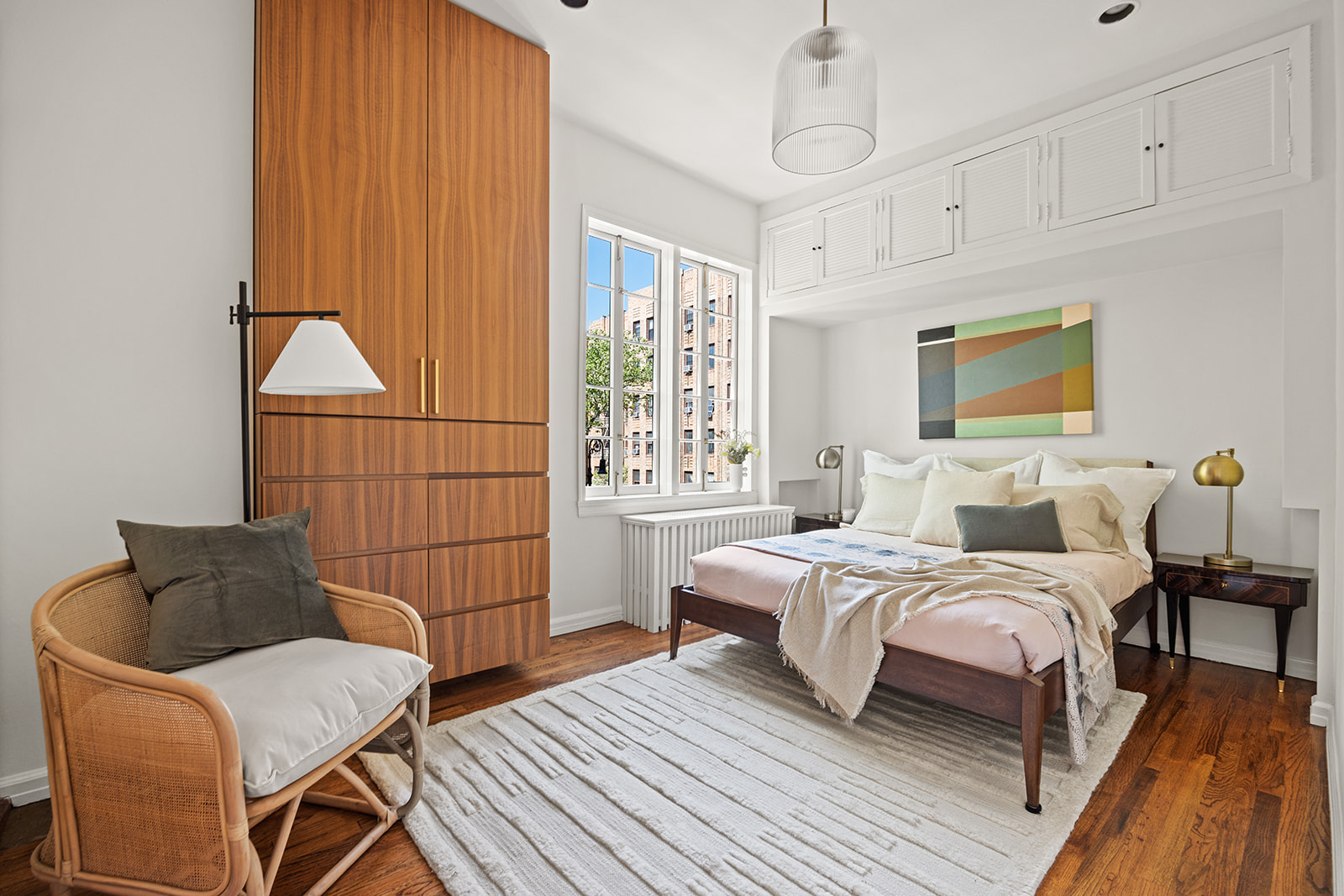 167 Clinton Street, Unit 3 Brooklyn, NY 11201 - Photo 13 of 31 a bedroom with a bed and wooden floor