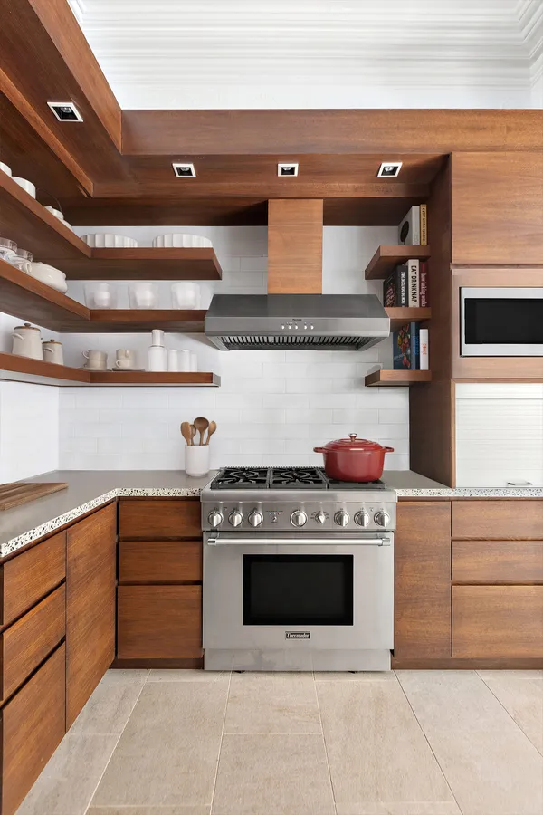 a kitchen with a stove and cabinets