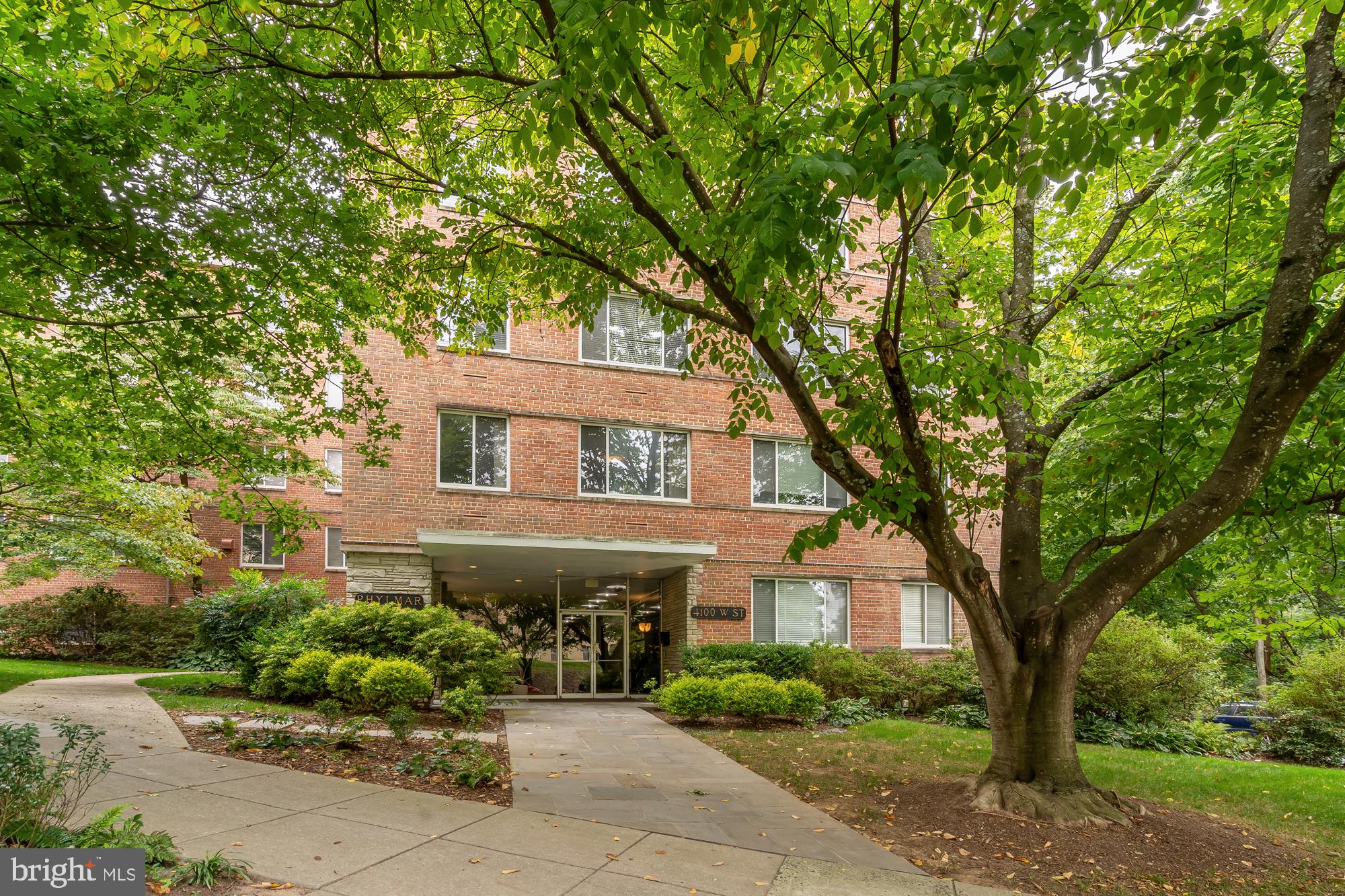 4100 W Street Northwest, Unit 314 Washington, DC 20007 - Photo 1 of 28 a front view of a house with garden