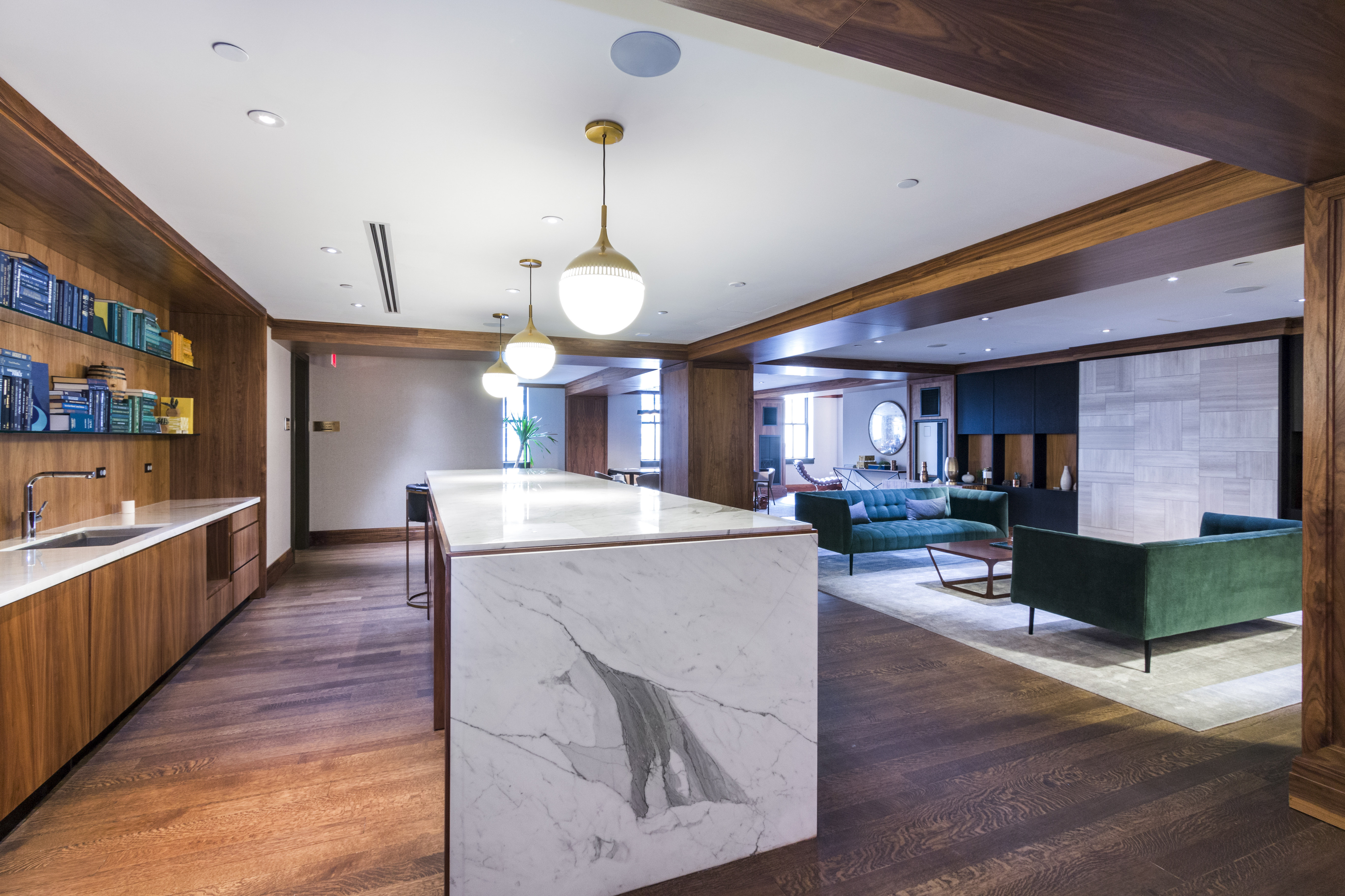 100 Barclay Street, Unit 13K Manhattan, NY 10007 - Photo 18 of 27 a large kitchen with stainless steel appliances kitchen island granite countertop a large counter top and wooden floors