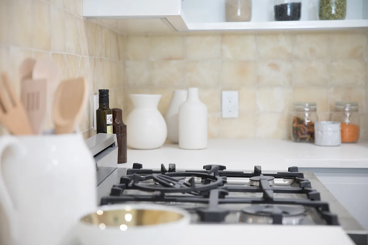863 Saint Marks Avenue, Unit 4A Brooklyn, NY 11213 - Photo 5 of 6 a kitchen with a sink and a stove with wooden floor