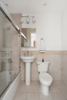 a bathroom with a sink toilet and bathtub