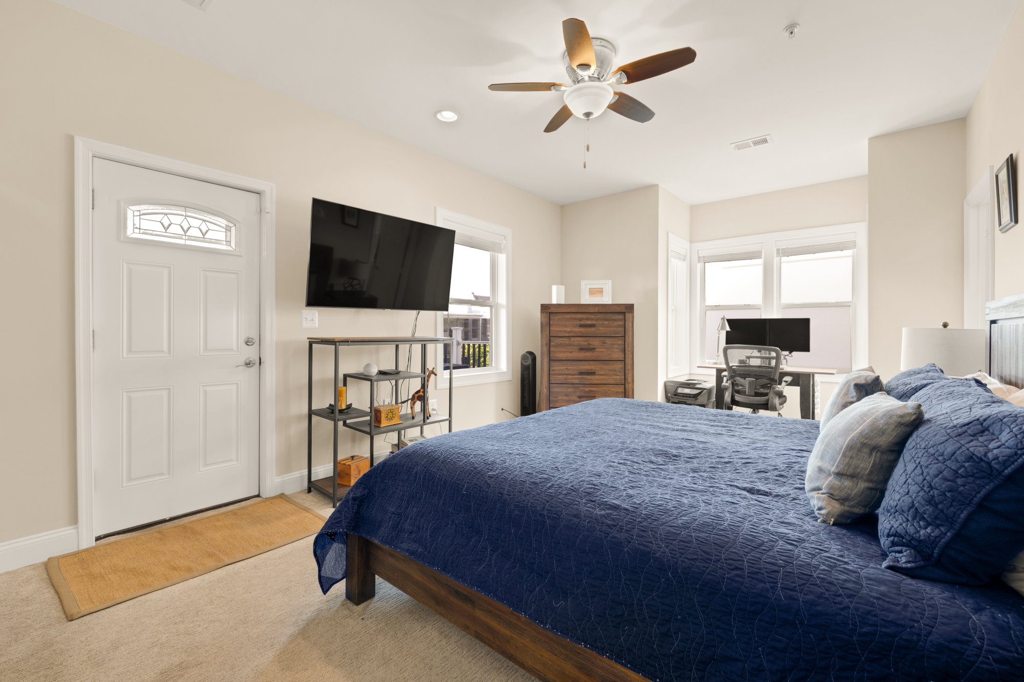 233 S Street Northeast, Unit 4 Washington, DC 20002 - Photo 28 of 37 a spacious bedroom with a bed and a flat screen tv