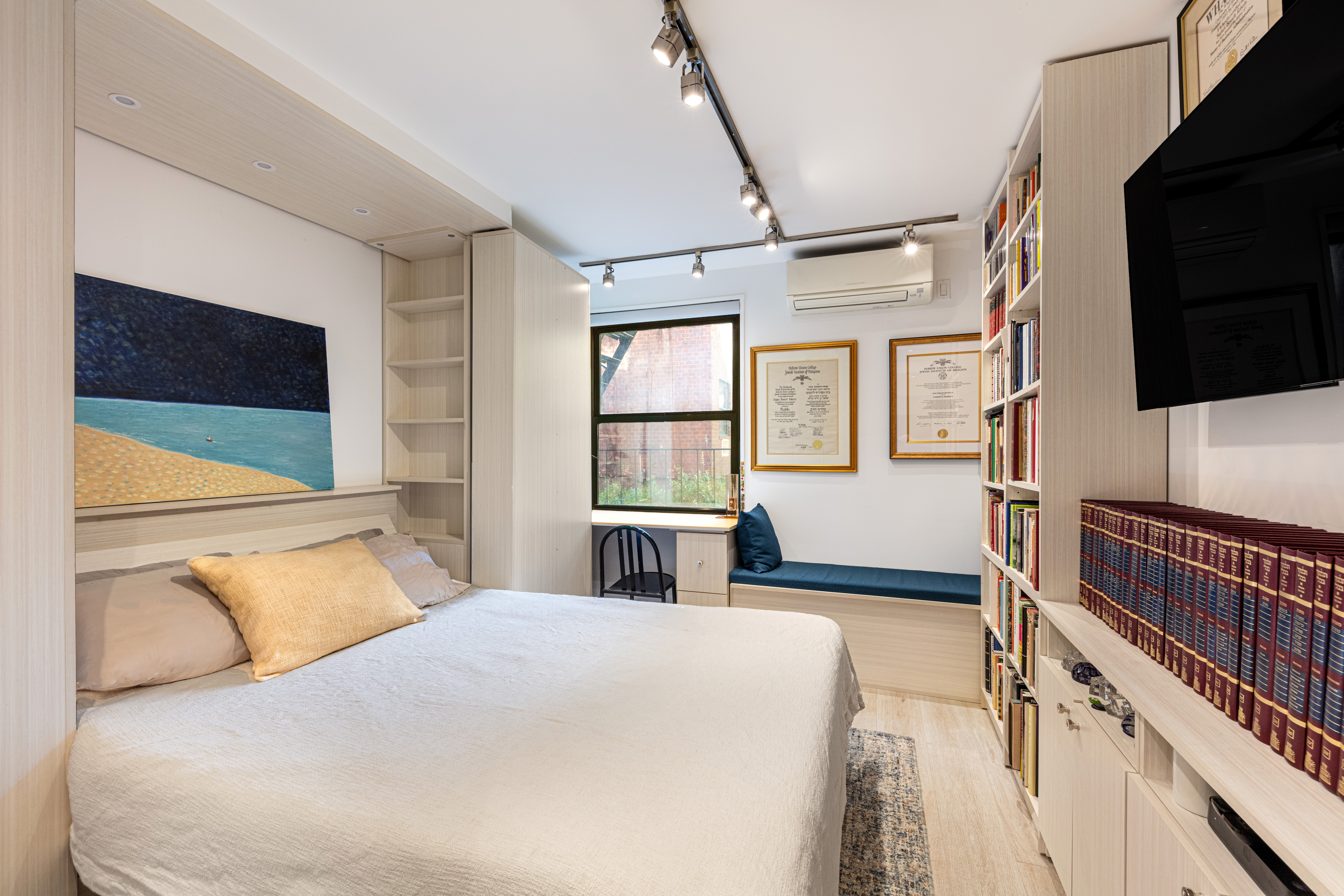 129 Barrow Street, Unit GA Manhattan, NY 10014 - Photo 13 of 17 a bedroom with a large bed and a flat tv screen on dresser