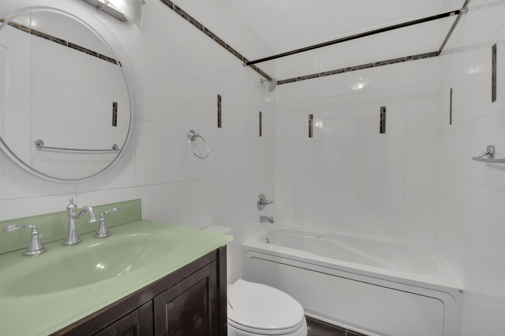 963 Kent Avenue, Unit D3 Brooklyn, NY 11205 - Photo 5 of 16 a bathroom with a sink toilet vanity and shower