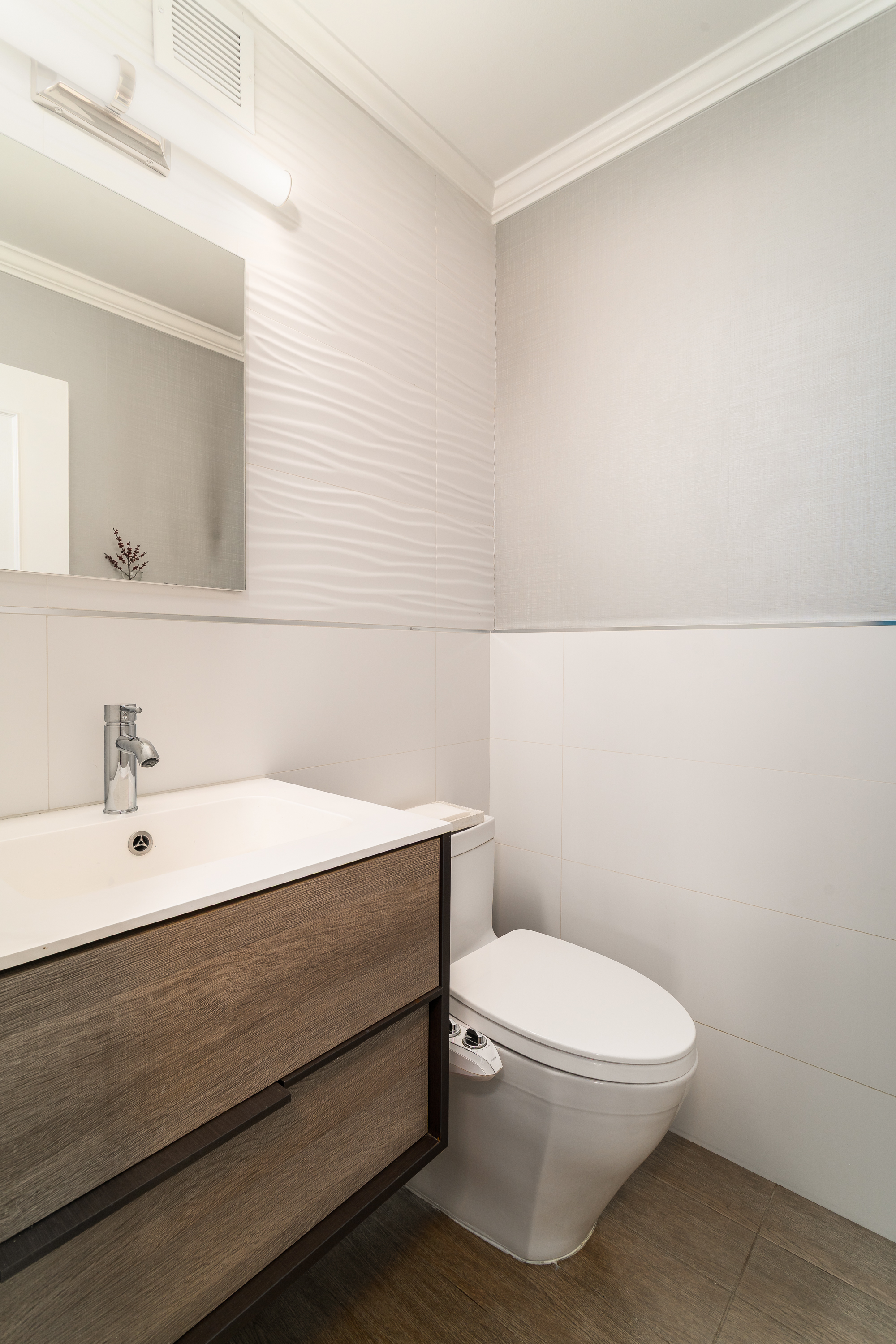530 East 72nd Street, Unit 7C Manhattan, NY 10021 - Photo 13 of 17 a bathroom with a toilet a sink and mirror