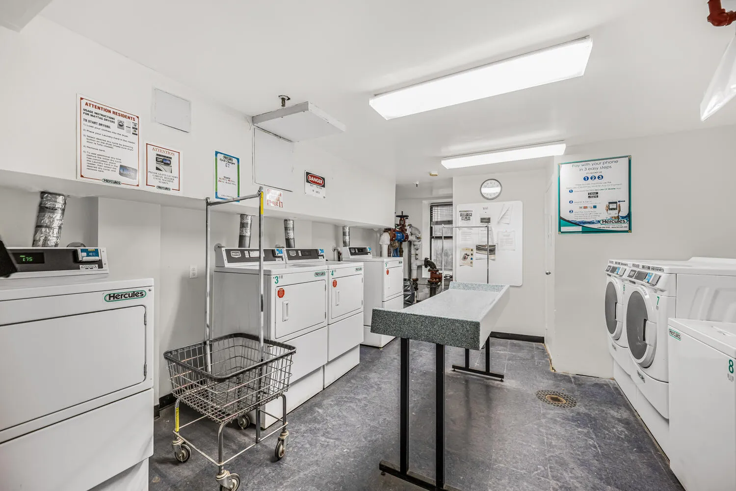 a workspace with furniture and white kitchen