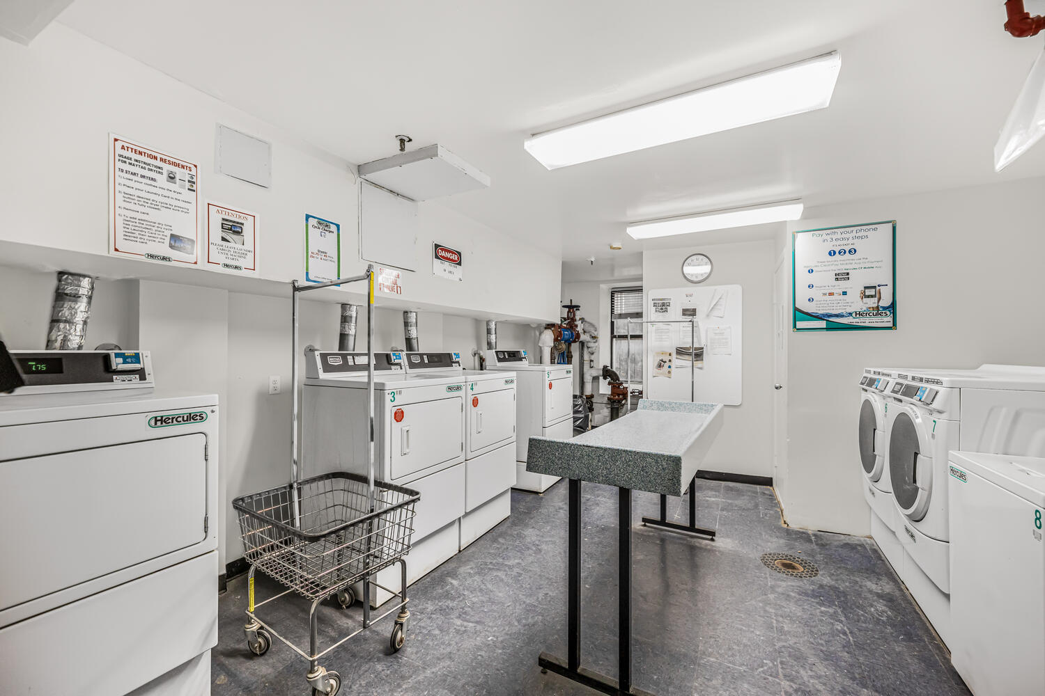 4 West 109th Street, Unit 4F Manhattan, NY 10025 - Photo 11 of 16 a workspace with furniture and white kitchen