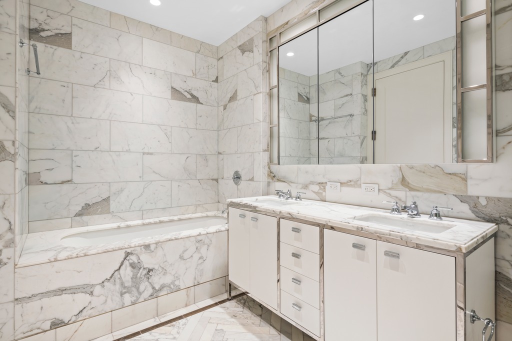 100 Barclay Street, Unit 21AD Manhattan, NY 10007 - Photo 20 of 40 a bathroom with a sink and a mirror
