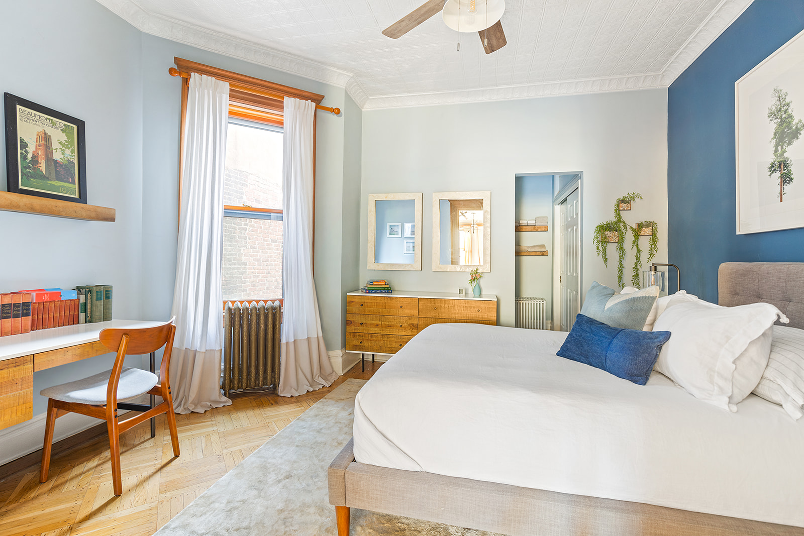 205 Park Place, Unit 13 Brooklyn, NY 11238 - Photo 4 of 8 a bedroom with a bed and wooden floor