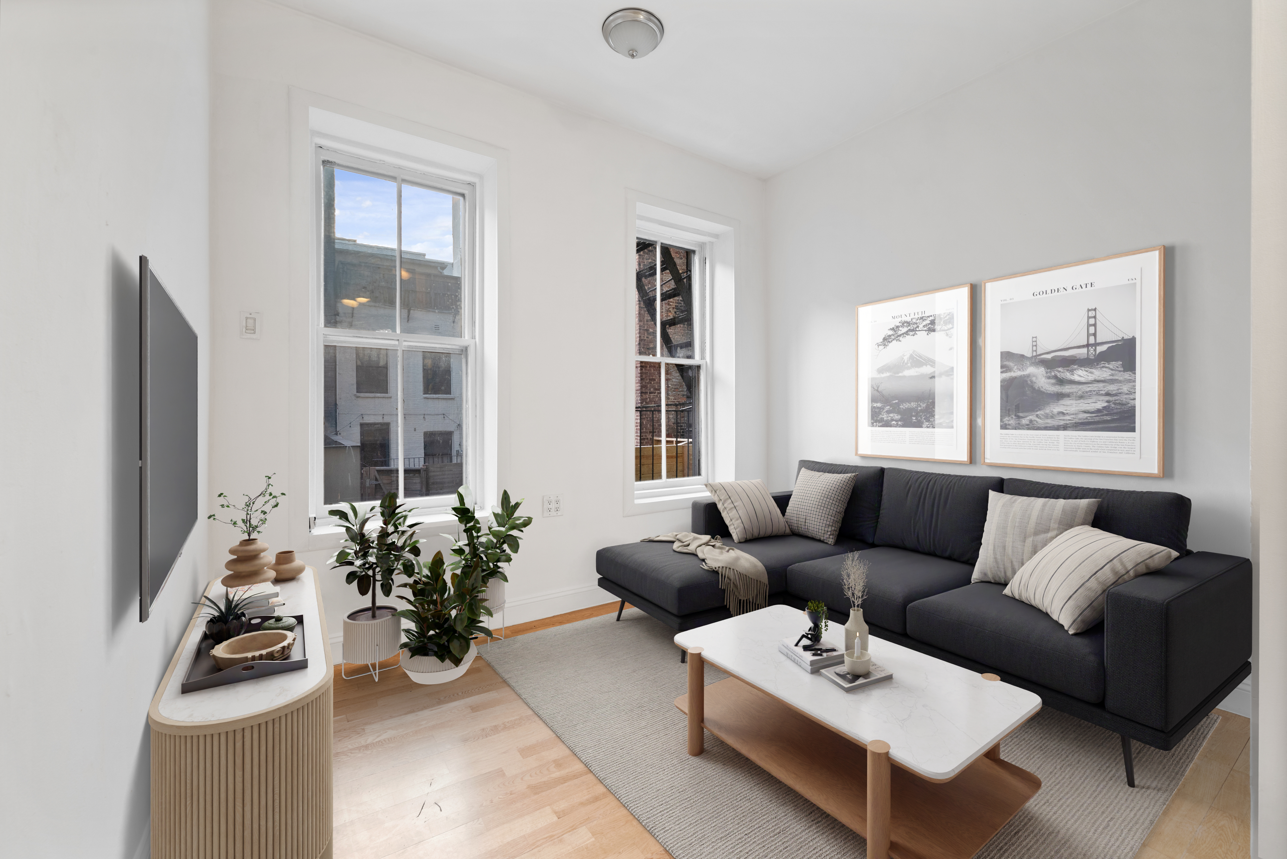 a living room with furniture a rug and a window