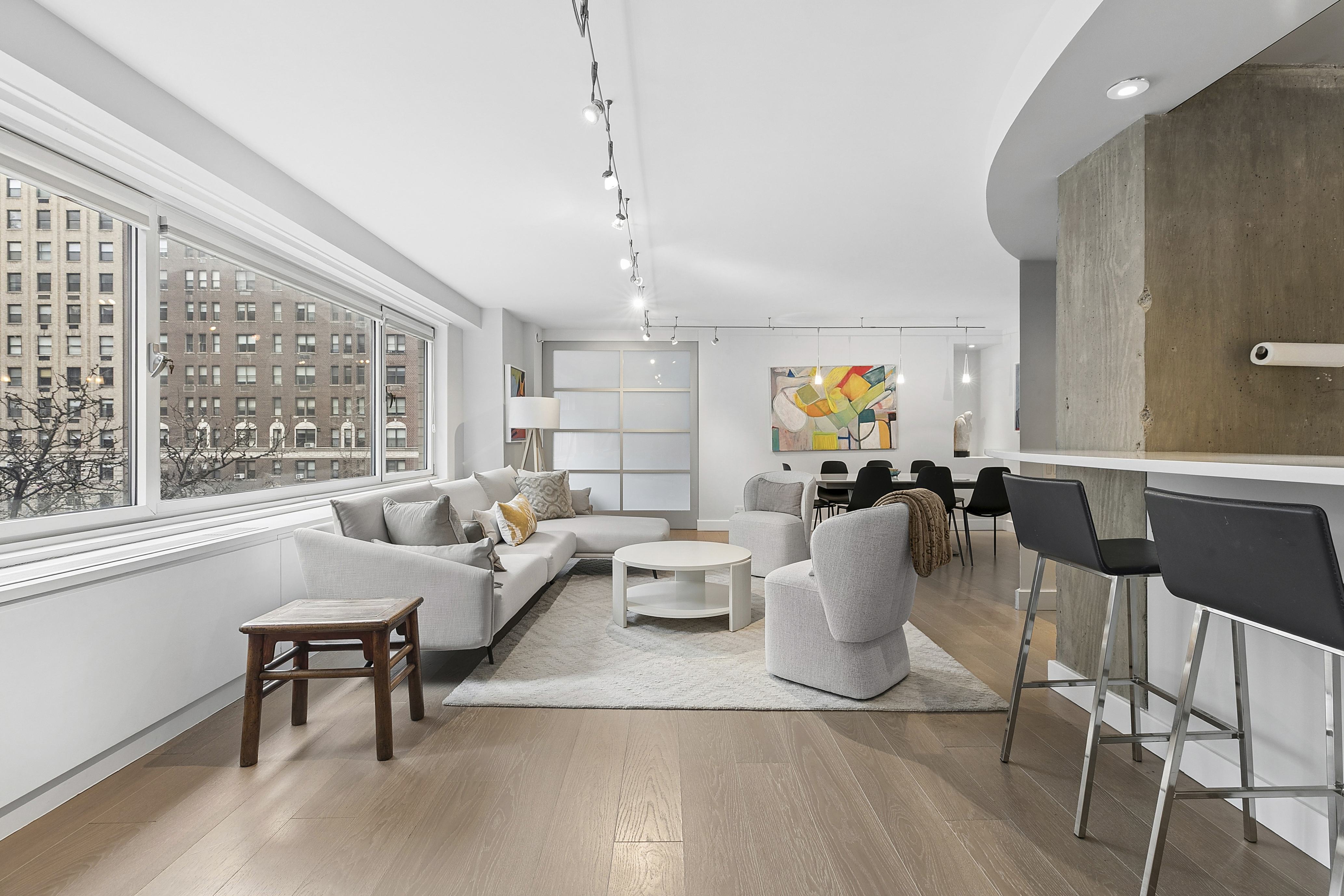 1065 Park Avenue, Unit 4BC Manhattan, NY 10128 - Photo 1 of 16 a living room with furniture and a large window