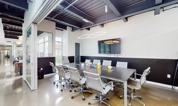 a dining room with furniture a rug and wooden floor