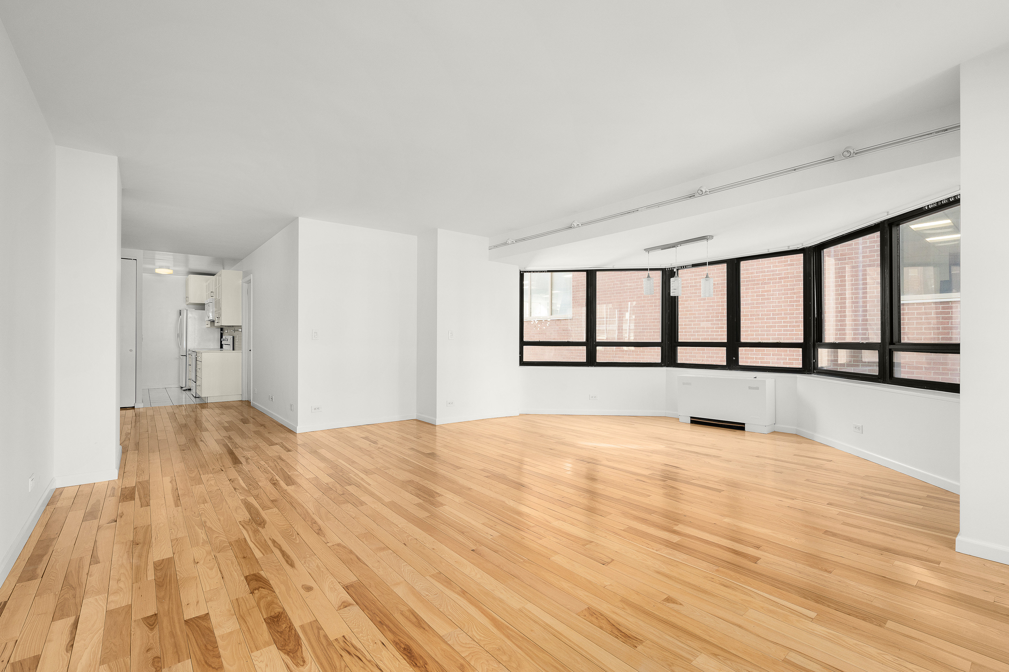 240 East 47th Street, Unit 4B Manhattan, NY 10017 - Photo 4 of 25 a view of an empty room with a window