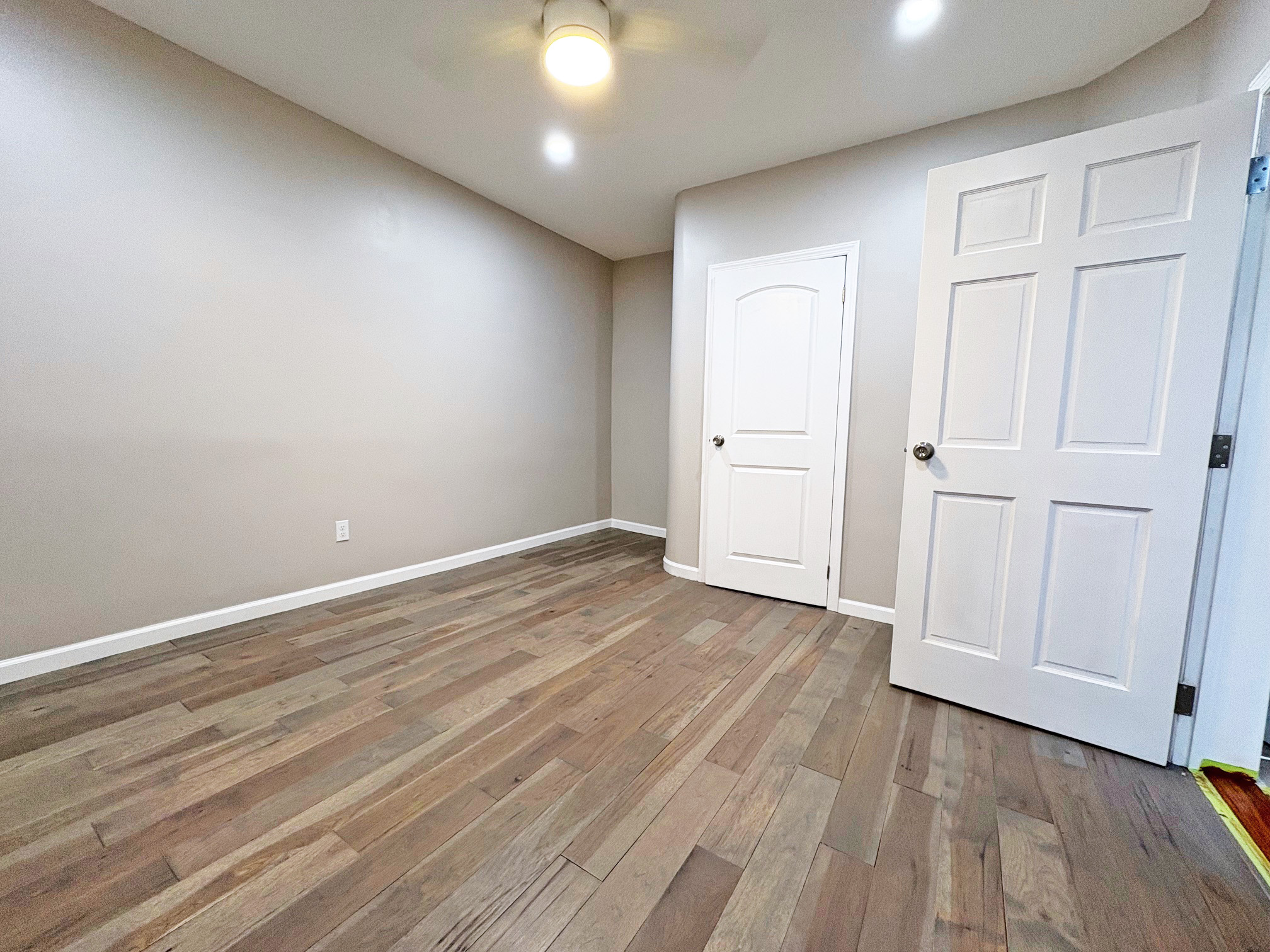 179 Covert Street, Unit 3 Brooklyn, NY 11207 - Photo 6 of 14 a view of an empty room with wooden floor