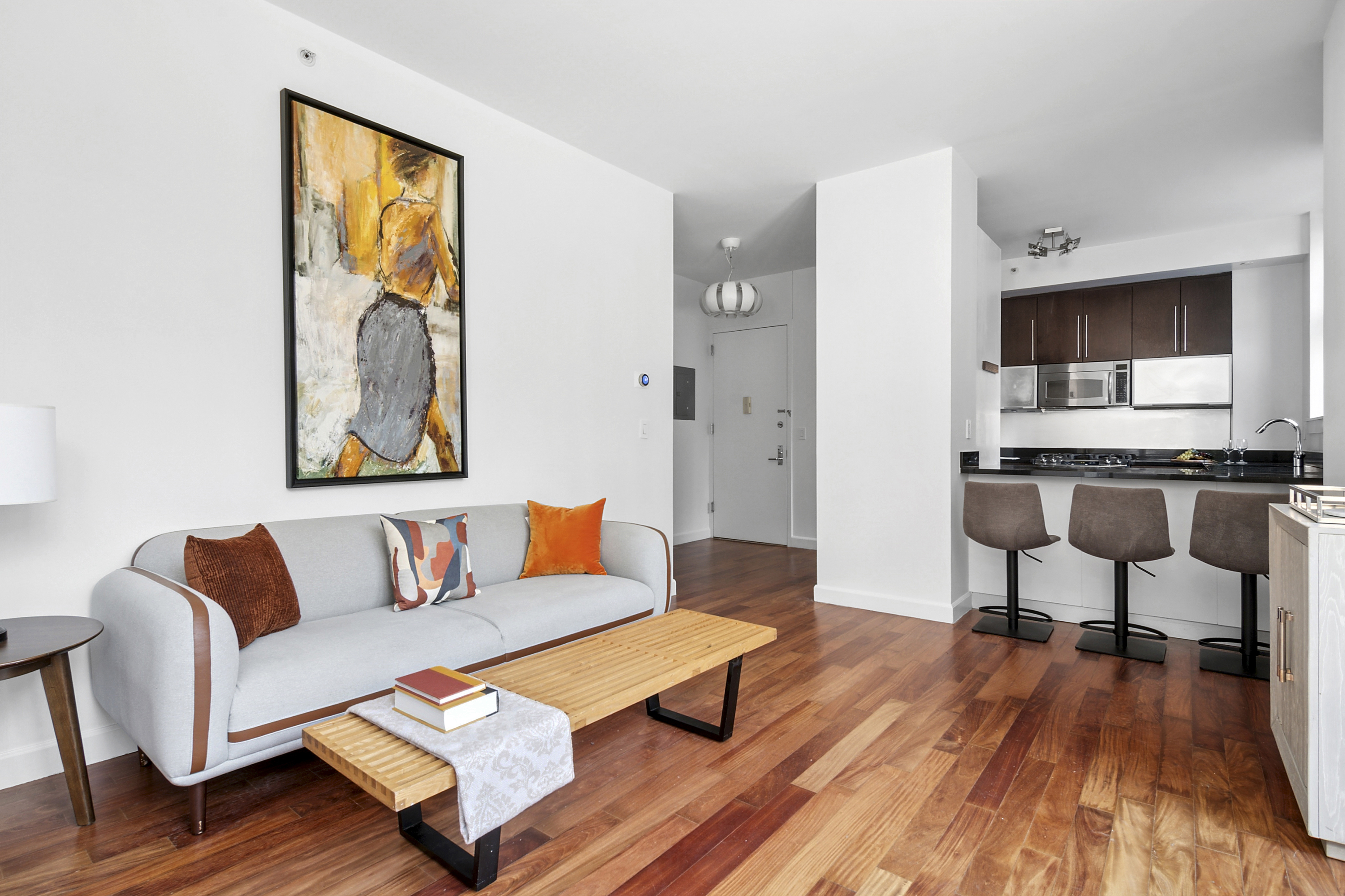 100 Jay Street, Unit 4H Brooklyn, NY 11201 - Photo 2 of 13 a living room with furniture and a wooden floor