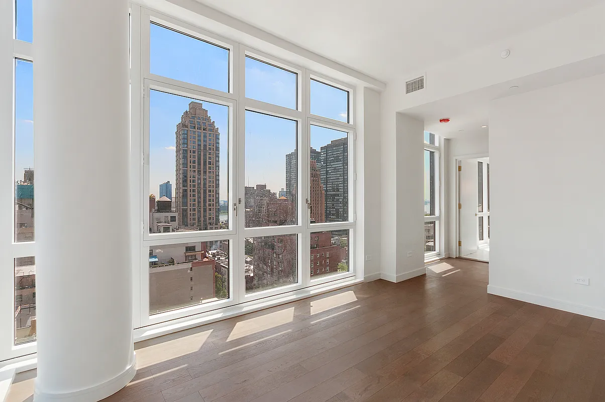 305 East 51st Street, Unit 14F Manhattan, NY 10022 - Photo 8 of 19 a view of an empty room with a window
