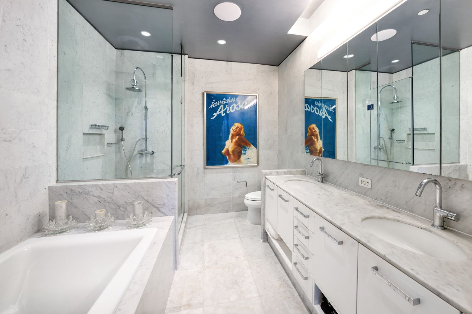 a bathroom with a double vanity sink and a shower