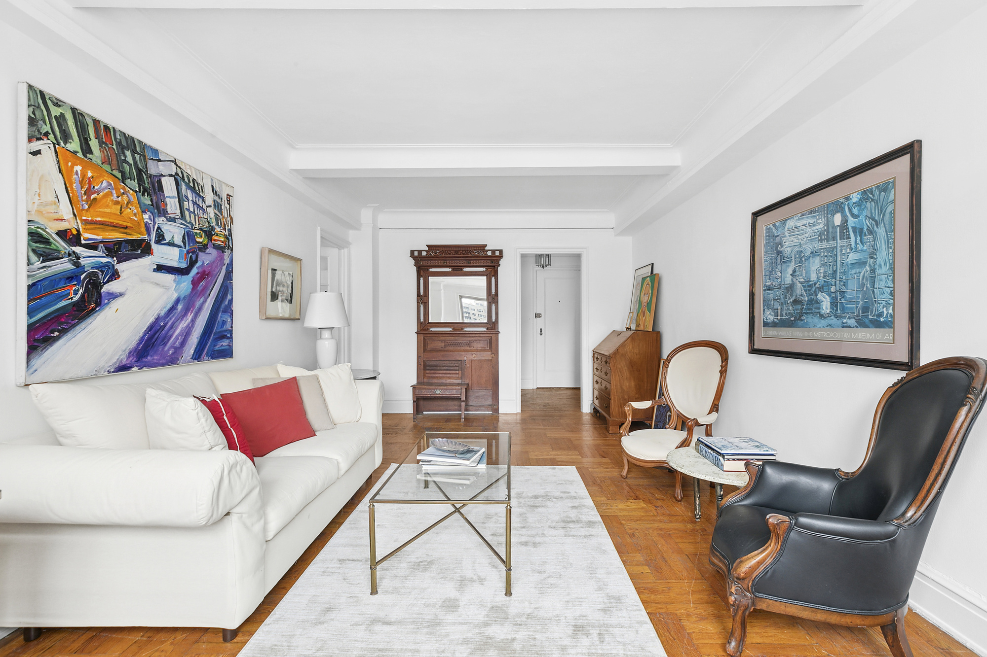 333 East 53rd Street, Unit 12L Manhattan, NY 10022 - Photo 3 of 9 a living room with furniture and a flat screen tv