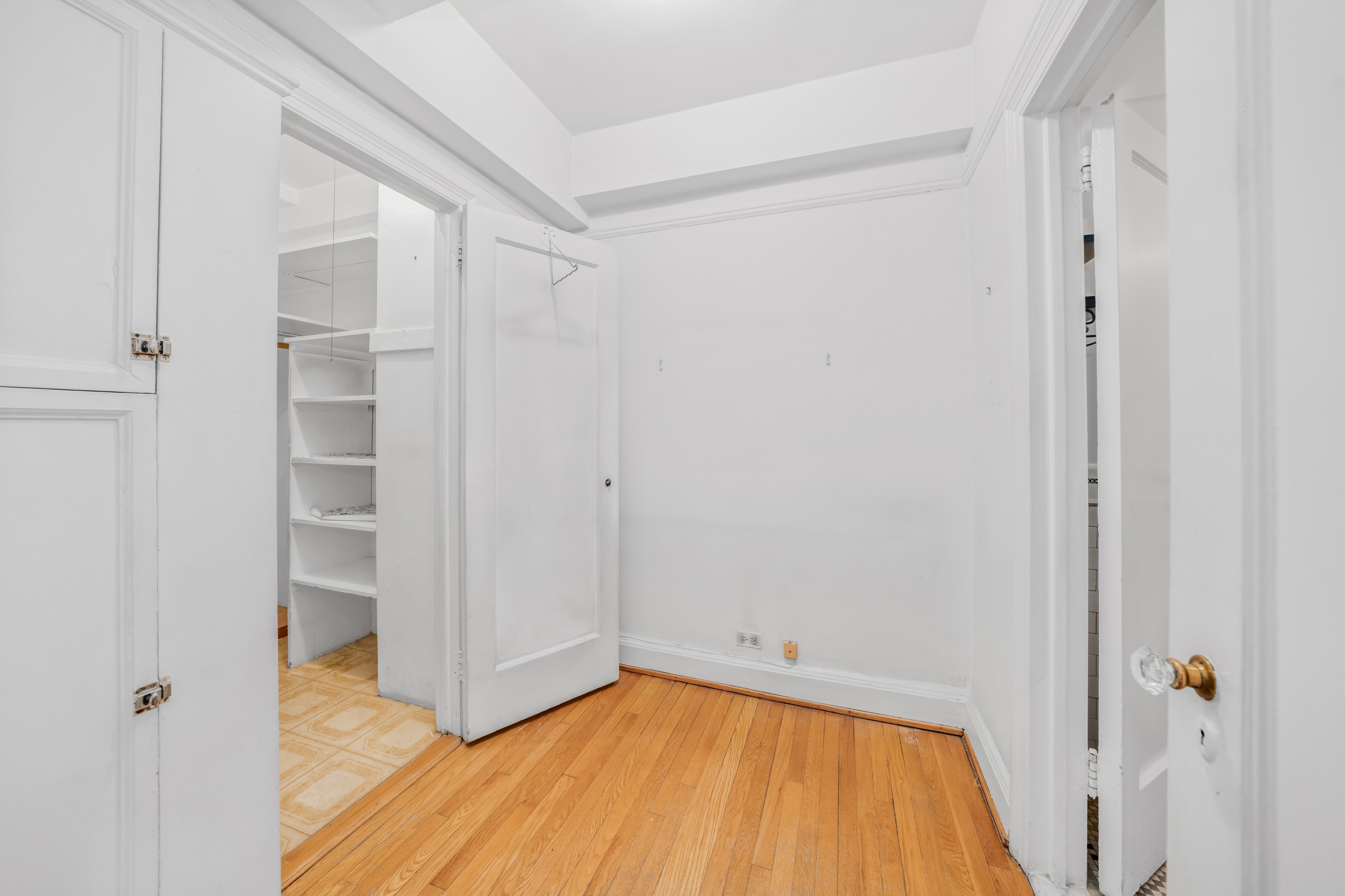 235 East 22nd Street, Unit 2R Manhattan, NY 10010 - Photo 5 of 15 a view of a room with wooden floor and small space