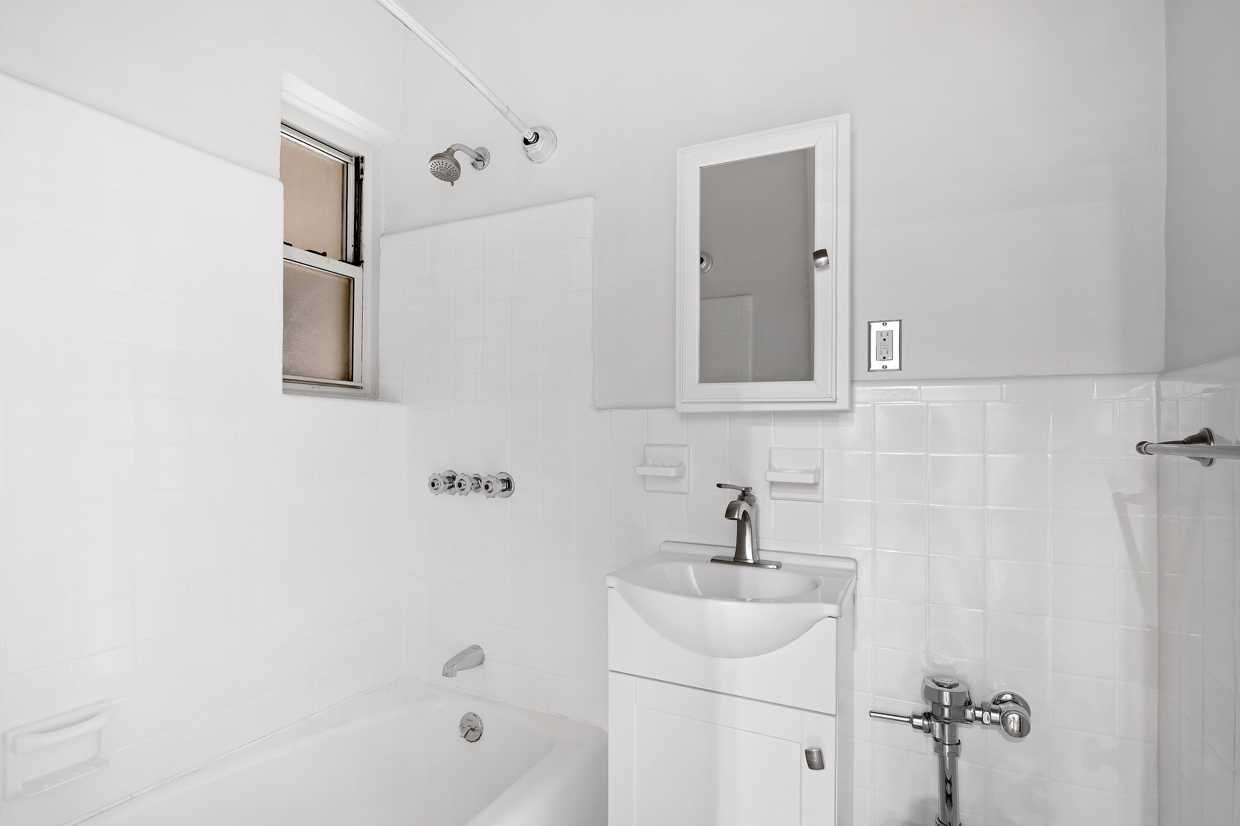 521 East 81st Street, Unit B Manhattan, NY 10028 - Photo 4 of 5 a bathroom with a sink a toilet and shower