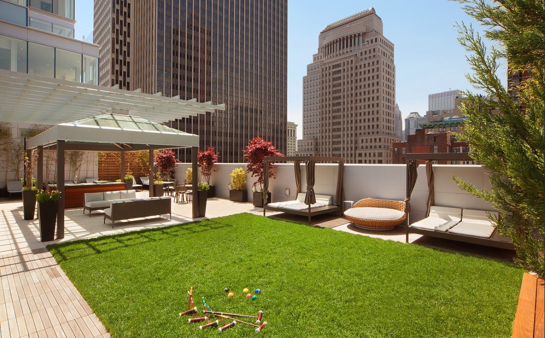 93 Worth Street, Unit 406 Manhattan, NY 10013 - Photo 8 of 11 a view of a patio with table and chairs and potted plants