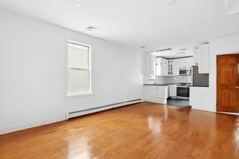 a view of a kitchen with a sink cabinets and a window