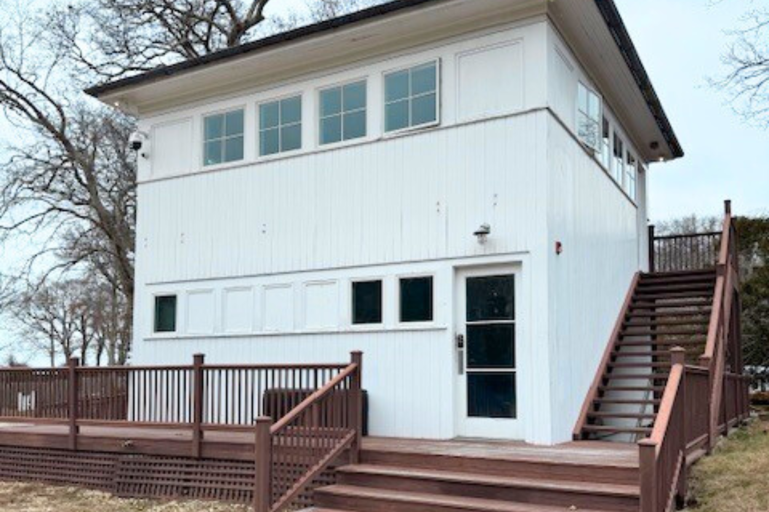 219 Three Mile Harbor Road East Hampton, NY 11937 - Photo 6 of 11 a view of a house with wooden deck stairs and wooden floor