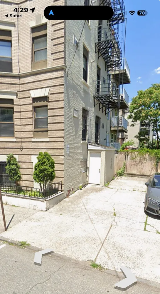 a view of a building with a yard