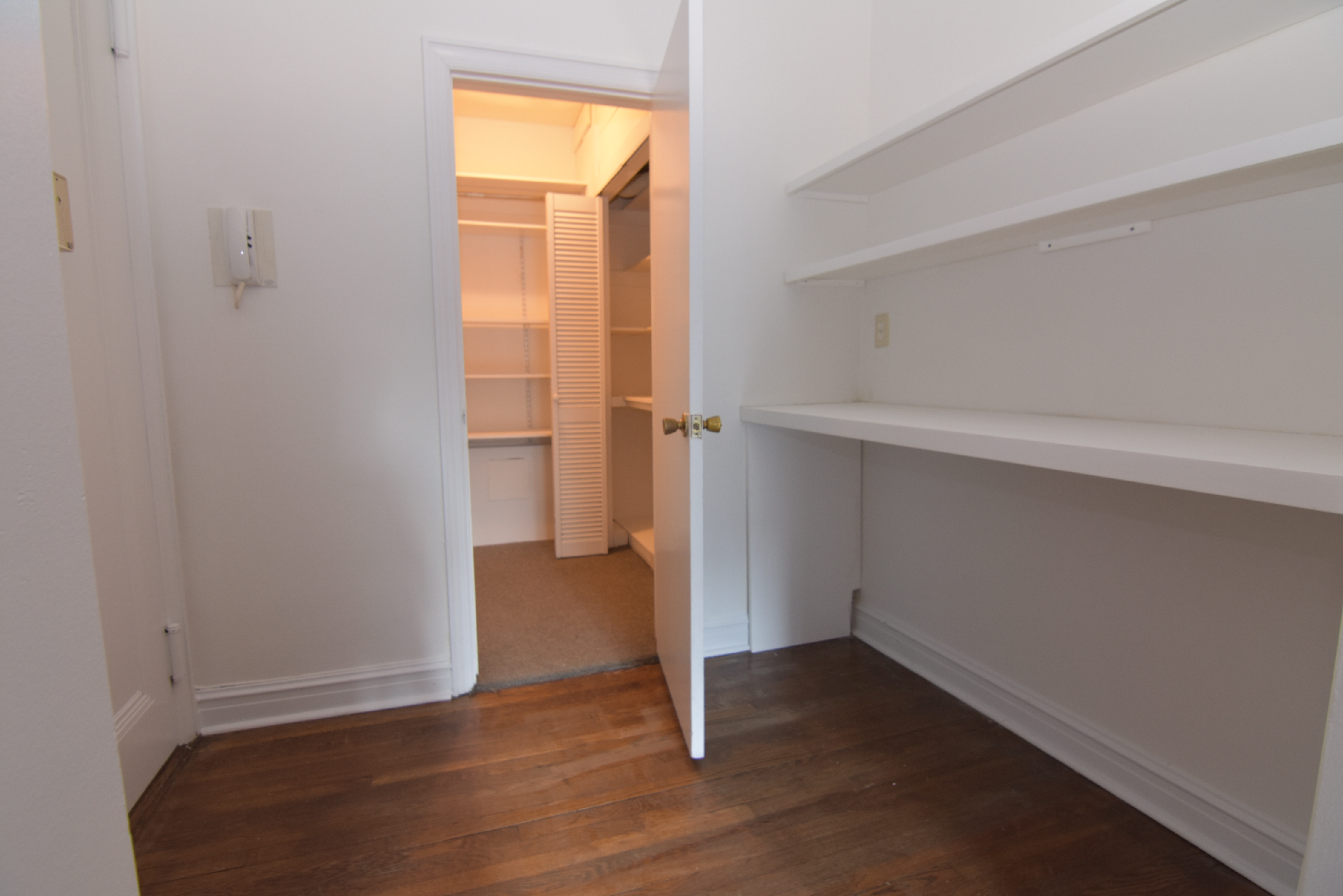 18 East 67th Street, Unit 2B/3B Manhattan, NY 10065 - Photo 17 of 18 a view of an empty room with wooden floor and a window