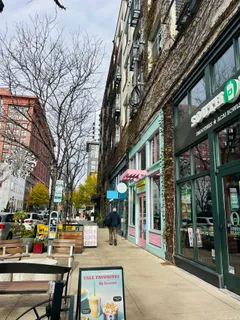 a view of a house with swimming pool and sitting area