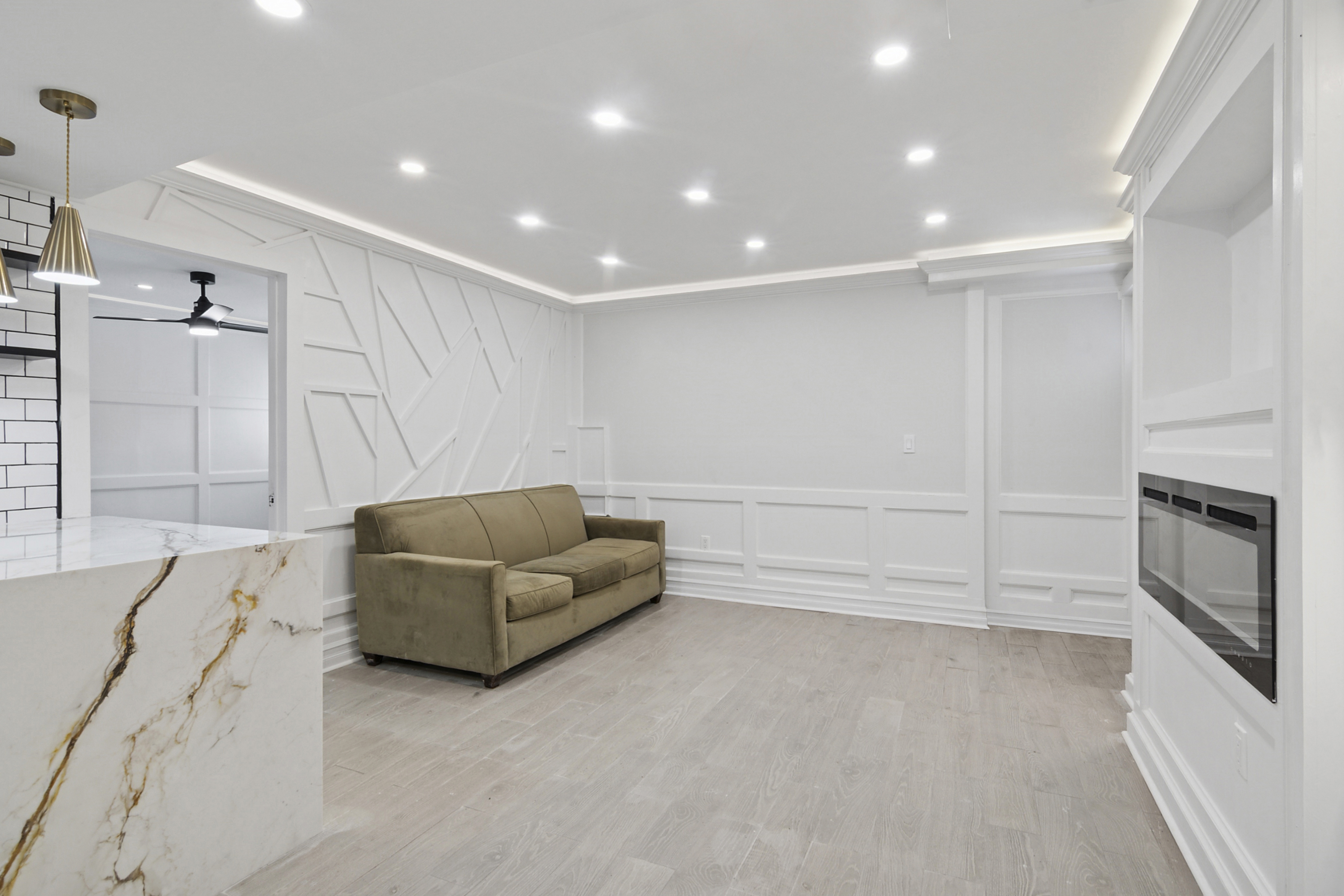 58-07 83rd Place, Unit 1 Queens, NY 11379 - Photo 2 of 5 a living room with furniture and a fireplace