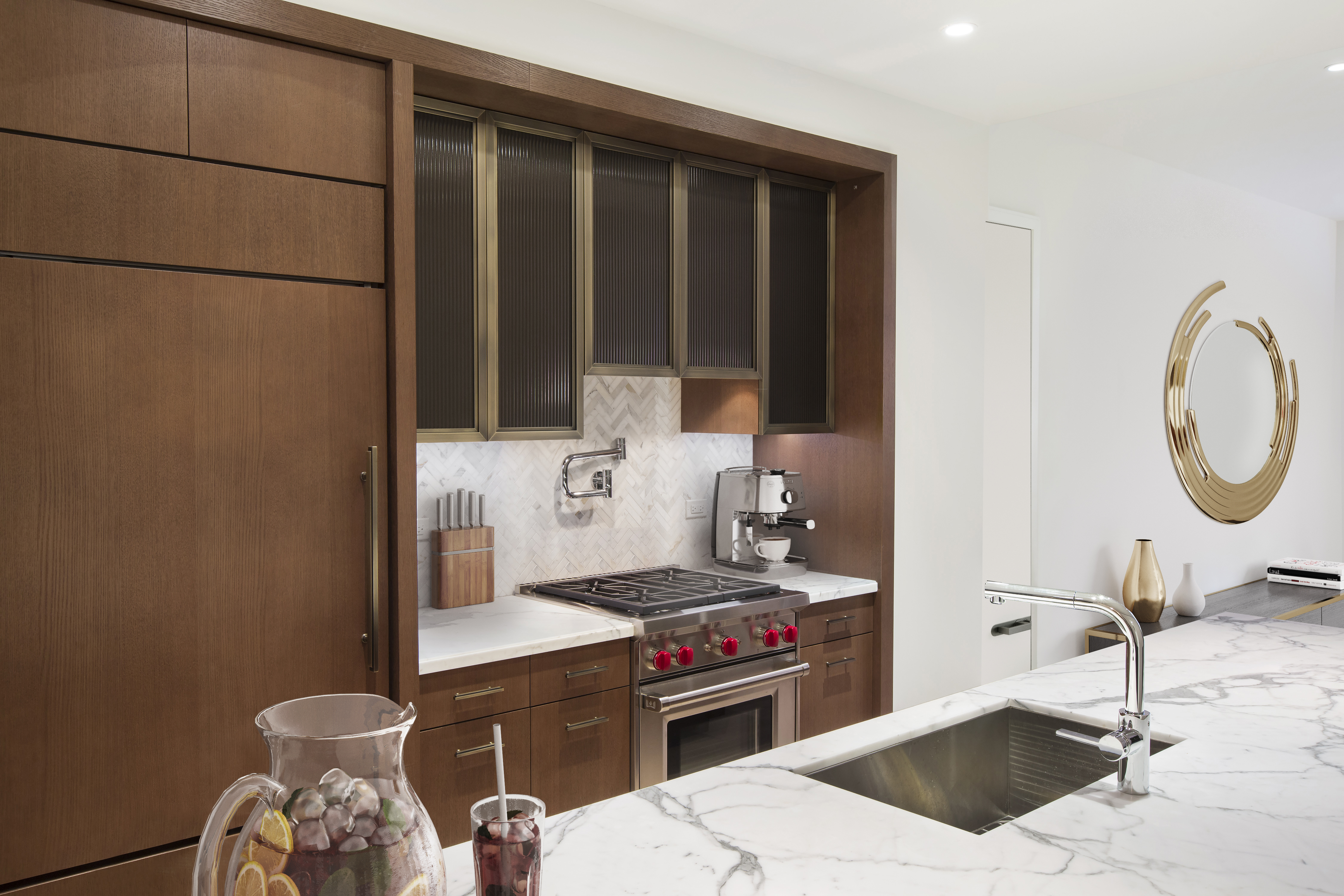 100 Barclay Street, Unit 17H Manhattan, NY 10007 - Photo 5 of 11 a kitchen with a sink and a stove top oven
