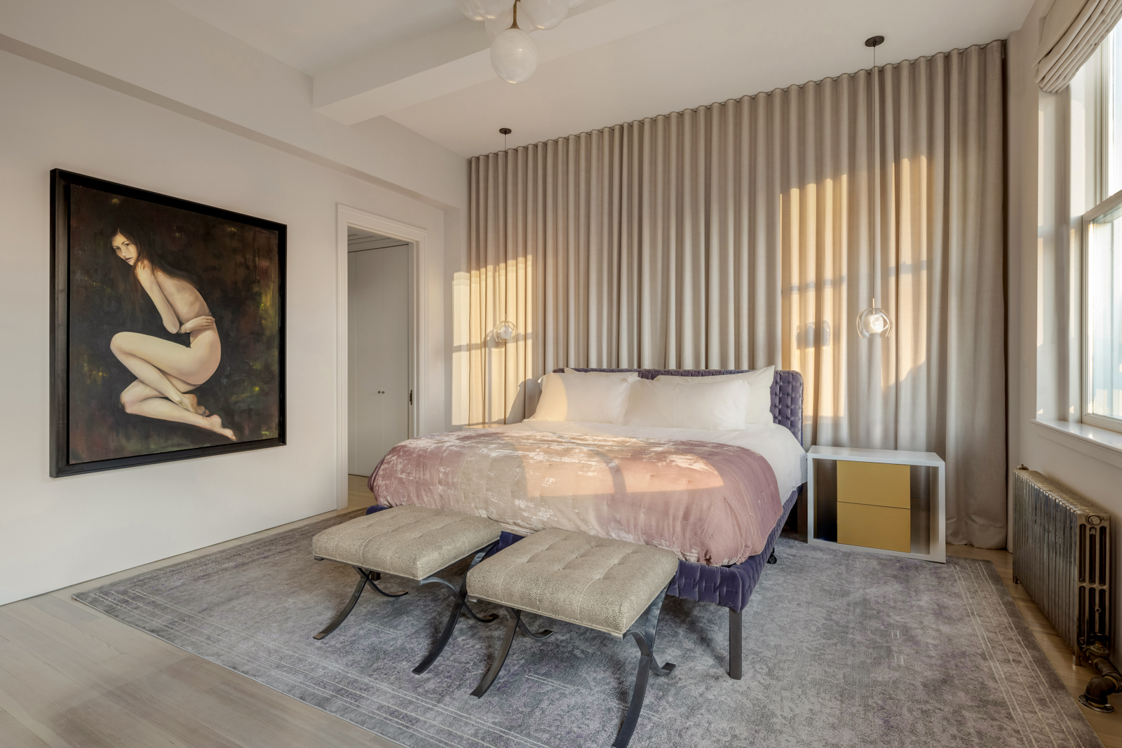 105 East 29th Street, Unit 12PH Manhattan, NY 10016 - Photo 10 of 24 a bed sitting in a spacious bedroom next to a window