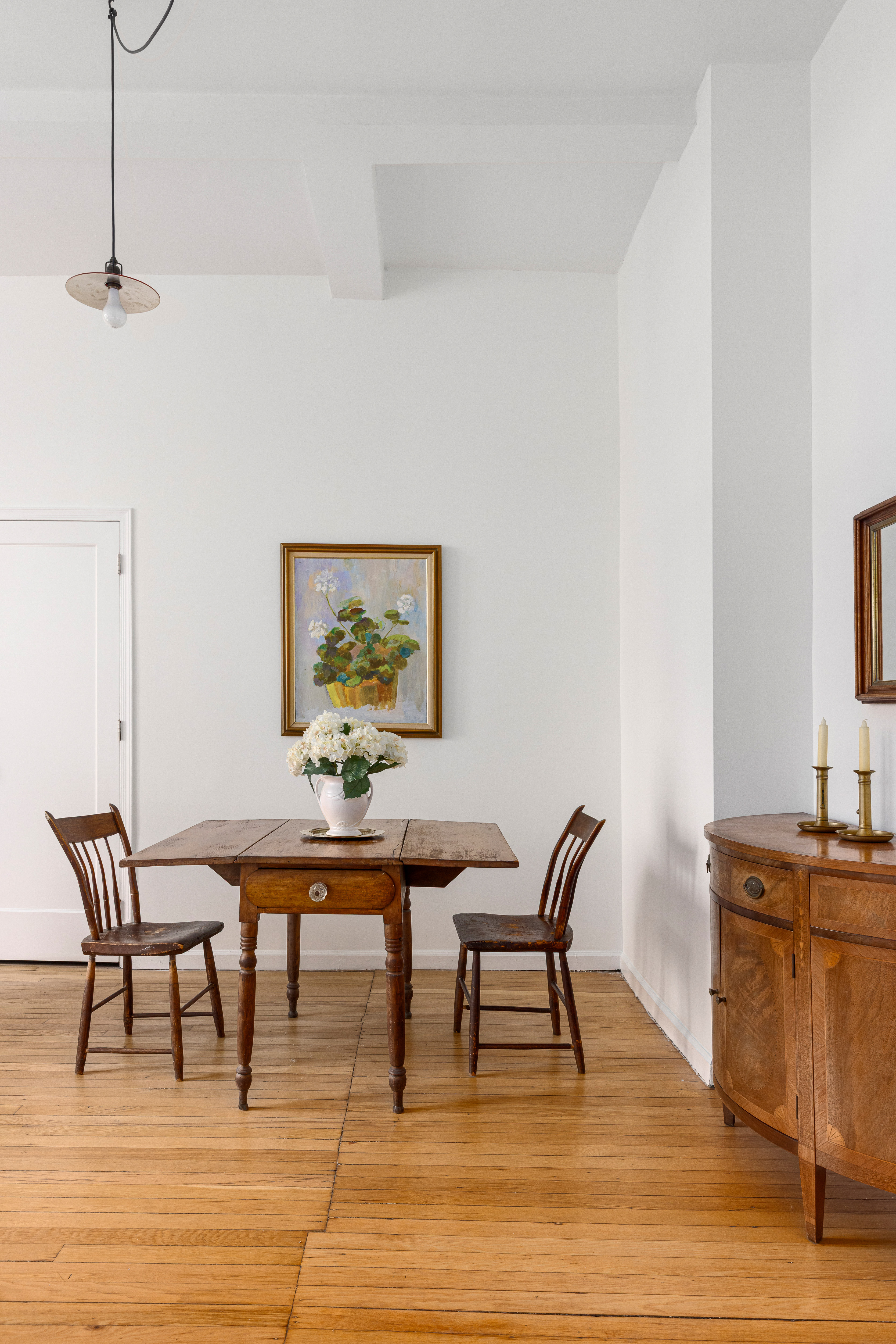 140 West 69th Street, Unit 56A Manhattan, NY 10023 - Photo 3 of 9 a view of a dining room with furniture and wooden floor