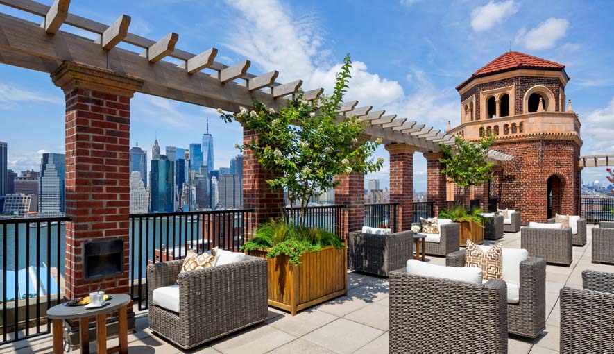 21 Clark Street, Unit RESIDENCE 1305 Brooklyn, NY 11201 - Photo 18 of 19 a view of a patio with couches table and chairs