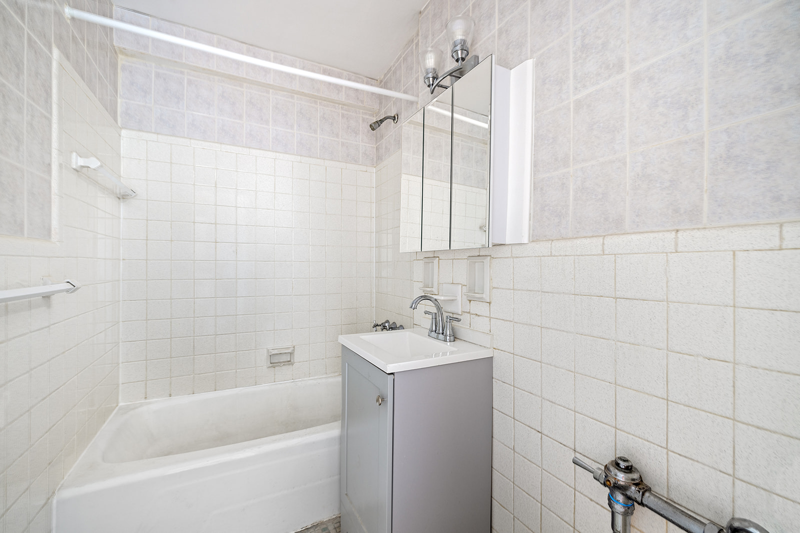 540 Ocean Parkway, Unit 5R Brooklyn, NY 11218 - Photo 8 of 11 a bathroom with a sink a toilet and shower