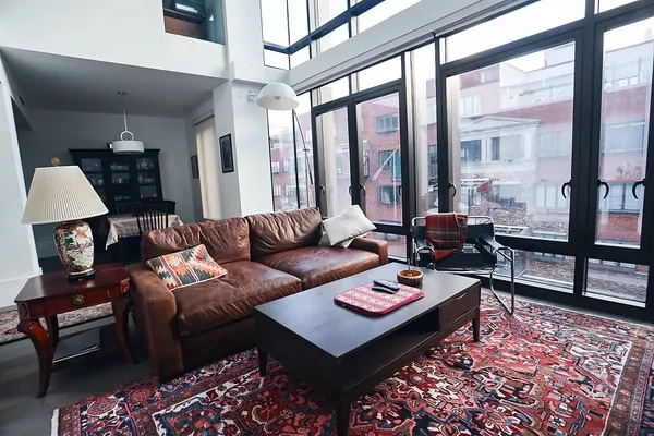 a living room with furniture and a rug